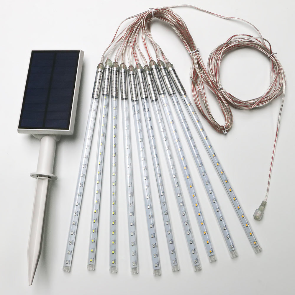 A set of solar-powered meteor lights, with a remote solar panel and cables for connection.