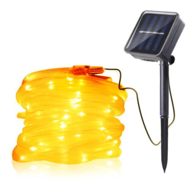 Solar LED rope light with solar panel and ground spike in warm white
