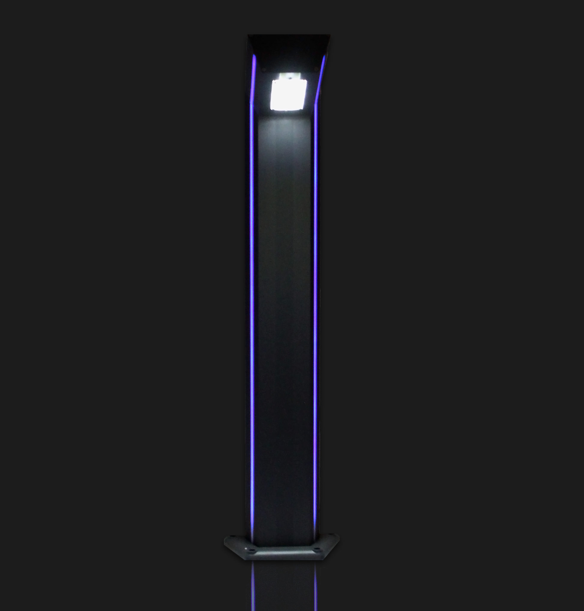 An industrial bollard in grey with a solar panel on top and a polycarbonate lens, featuring a surface mounted base and an optional LED strip for decorative appeal.