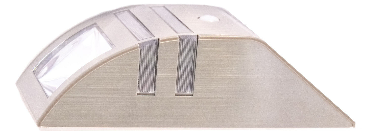 A stainless steel step light with a built-in solar panel and motion sensor, designed for outdoor installation.