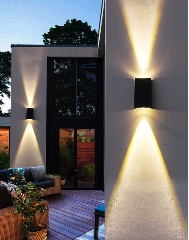 Black LED up/down solar wall light with a solar panel, constructed from machined aluminium shown mounted on a wall